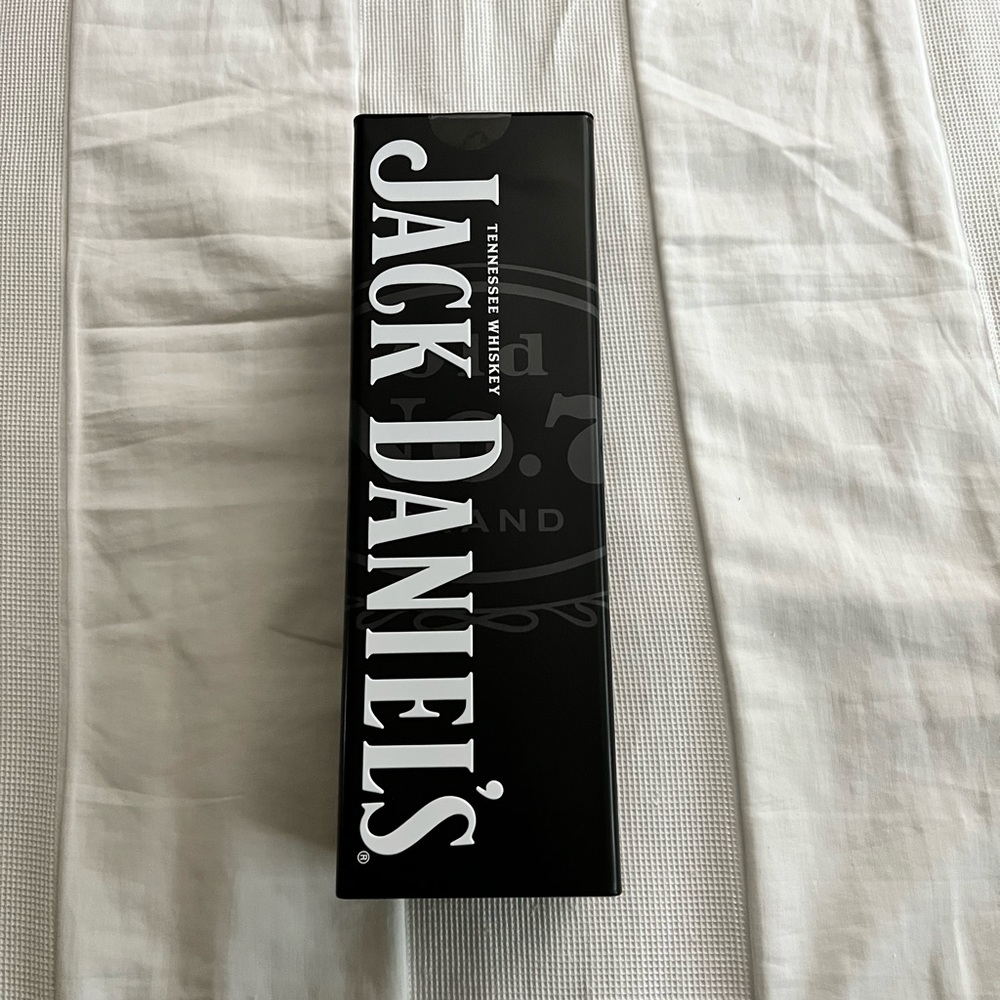 Empty Jack Daniels tin canister
